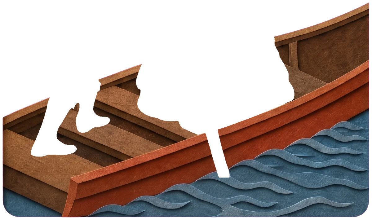 The red wooden side of the boat with small blue waves curling beside it